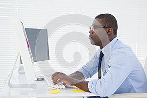 Focused businessman sitting at his desk working