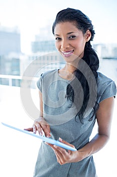 Focused businesswoman using digital tablet