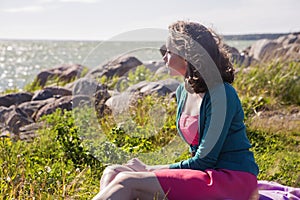 Focused female on romantic evening at seaside