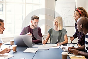 Focused group of designers working together in an office