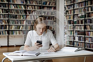 Focused hardworking graduate student girl doing study homework