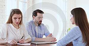 Focused hr team finishing job interview with vacancy applicant.
