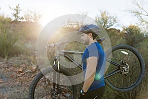 Focused Man Carrying Bicycle