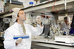 Focused man technician working in research laboratory