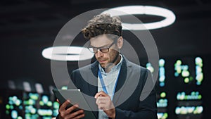 Focused IT man working tab computer at datacenter closeup. System administrator