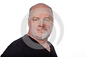 Focused Middle-Aged Man with Half Shaved Beard in Stylish Black T-Shirt - Confident Portrait on White Background