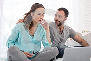 Focused pregnant woman and man listening to lecture