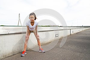 Focused runner outdoors resting with big smile