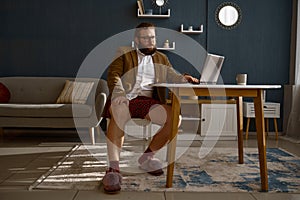 Focused smart guy geek expert working online