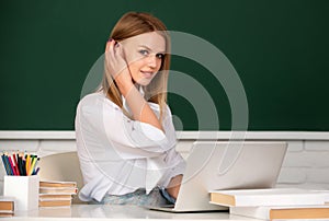 Focused student, young woman online watching webinar on laptop, listening learning education course. Portrait of