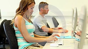 Focused students working in computer room