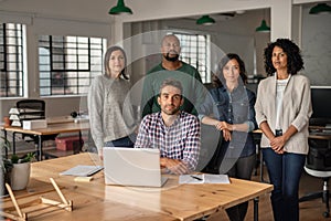 Focused team of diverse designers working together in an office