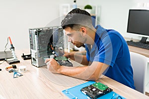 Focused technician checking the pc hardware