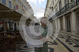 Focused woman checking map