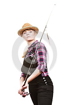 Focused woman looking at fishing rod float