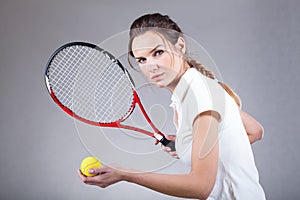 Focused woman playing tennis