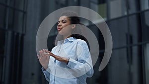 Focused worker meditating at office building closeup. Calm businesswoman relax