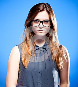 Focused young woman with nerd glasses, strict girl