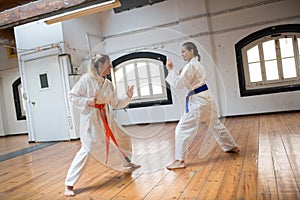 Focused young women at karate training session