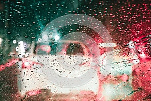 Focusing on the rain droplets, tailights out of focus,Rainy nigh