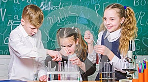 Focusing on work. Little children at laboratory. students doing biology experiments with microscope. Lab microscope