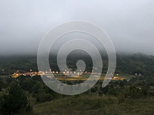 Fog above camping in the mountains