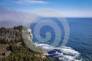 Fog bank rolling towards Cap GaspÃ© in Forillon National Park, QuÃ©bec, Canada.