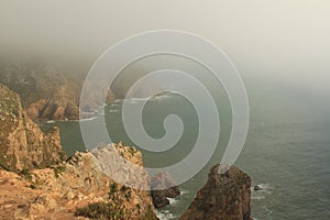 Fog. Cliffs of Cabo da Roca on the Atlantic Ocean in Sintra, Portugal, the westernmost point on the continent of Europe