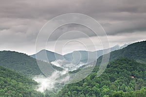 Fog and cloud mountain valley landscape