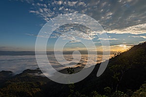 Fog and cloud mountain valley landscape on sunrise