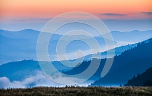 Fog and cloud mountain valley landscape