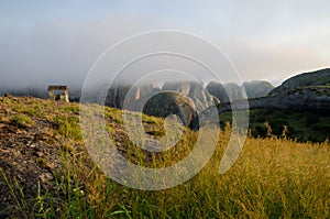 Fog and concrete hut at Black Rocks of Pungo Andongo or Pedras Negras in Angola