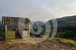 Fog and concrete hut at Black Rocks of Pungo Andongo or Pedras Negras in Angola photo