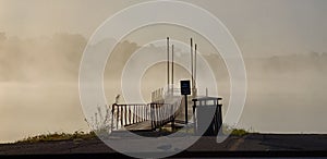 Fog Consuming Lake With Dock