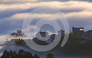 The fog cover Dalat plateau lands, Vietnam, background with magic of the dense fog and sun rays, sunshine at dawn part 15