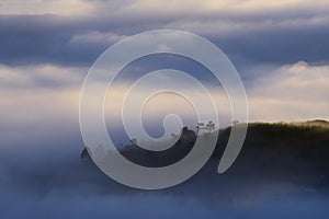 The fog cover Dalat plateau lands, Vietnam, background with magic of the dense fog and sun rays, sunshine at dawn part 16