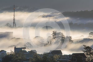 The fog cover Dalat plateau lands, Vietnam, background with magic of the dense fog and sun rays, sunshine at dawn part 5