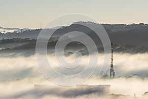 The fog cover Dalat plateau lands, Vietnam, background with magic of the dense fog and sun rays, sunshine at dawn part 6