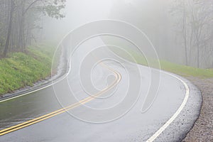 Fog Covers Curving Smoky Mountain Road With Copy Space