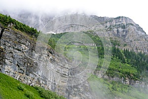 Fog covers the glaciers and mountains in Glacier National Park.