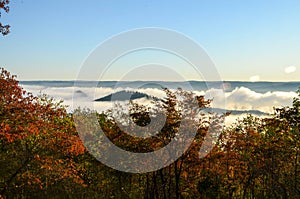 Fog covers the rolling hills below. View from atop Morrow Mountain state park.