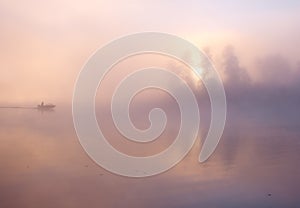 Fog fishing boat lake