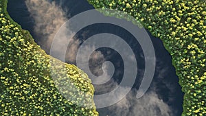 Fog on a lake. Top down view of a golden orange sunlight moving on a lake