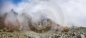 Fog on Mountains with Rocks in Foreground