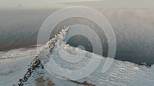 Fog over calm sea in cold winter day