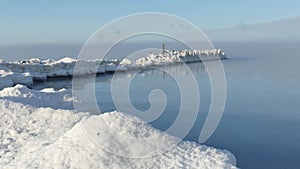 Fog over calm sea in cold winter day