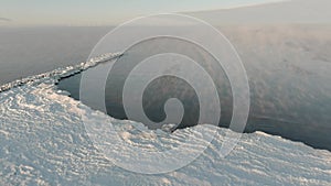 Fog over calm sea in cold winter day