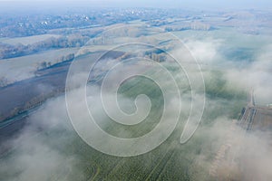 The fog over the countryside in Europe, in France, in the Center region, in the Loiret, towards Orleans, in Winter, during a sunny