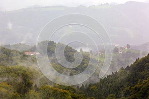 Fog over mountain landscape photo