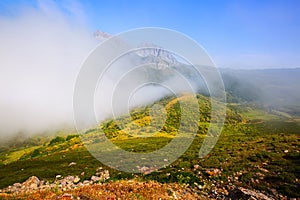 Fog over mountains in summer photo